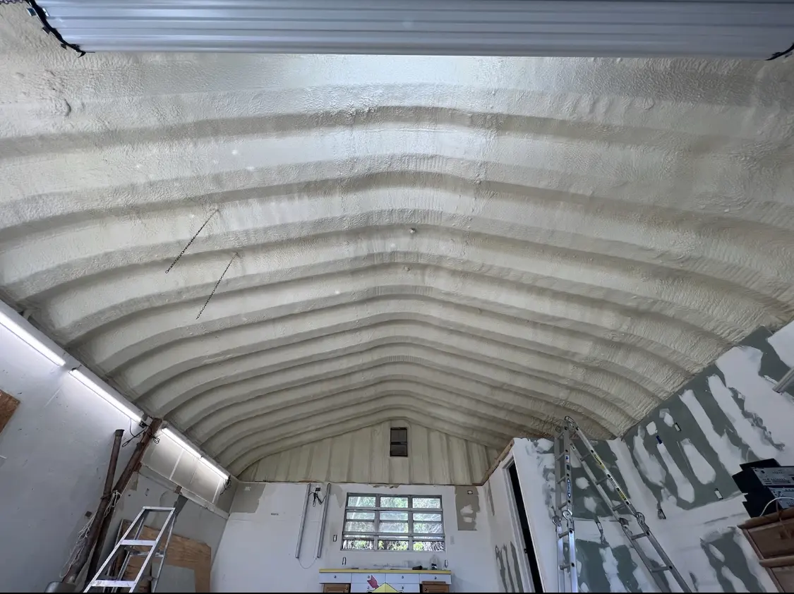 Spray polyurethane foam applied to the underside of a metal roof deck in Perris